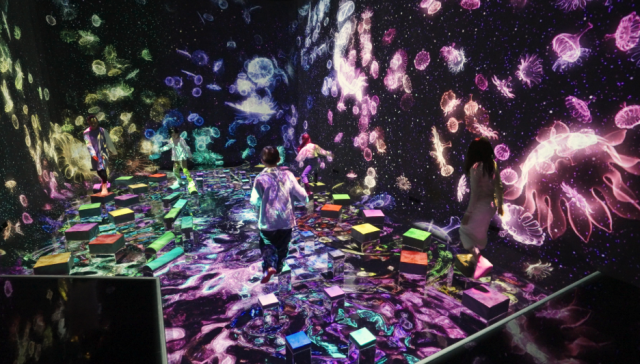 teamLab, Balance Stepping Stones in the Invisible World (c) teamLab - Balance Stepping Stones are stepping stones that interactively change when a person steps on them, emitting a color and tone that affect the space. When a person steps on a stone, it wobbles in various ways.